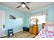 Cozy bedroom with light blue walls, window, and twin bed at 4305 S Ocean Blvd. # 205, North Myrtle Beach, SC 29582