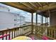 Balcony overlooking ocean with seating for two at 4305 S Ocean Blvd. # 205, North Myrtle Beach, SC 29582