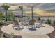Community fire pit with seating area overlooking lake at 292 Hawks Run Dr., Calabash, NC 28467