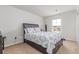 Bright bedroom with a queen-size bed and window views at 3519 Cornflower Way, Conway, SC 29526