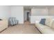 Open loft space with couch and view down hallway at 3519 Cornflower Way, Conway, SC 29526