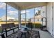 Relaxing screened porch with seating for lounging at 3519 Cornflower Way, Conway, SC 29526