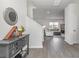 Bright and spacious entryway with a console table, mirror, and view of the living room at 3519 Cornflower Way, Conway, SC 29526