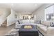 Open concept living room with sectional sofa, offering a view into the kitchen area at 3519 Cornflower Way, Conway, SC 29526