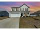 Two-story house with a white exterior and lawn at 3519 Cornflower Way, Conway, SC 29526