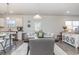 Kitchen features a dining area with a wooden table and gray cushioned chairs at 3519 Cornflower Way, Conway, SC 29526