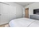 Bedroom with a full-size bed and double doors at 3519 Cornflower Way, Conway, SC 29526