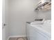 Laundry room with washer, dryer, and shelving at 3519 Cornflower Way, Conway, SC 29526