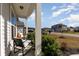 Relaxing front porch with rocking chair, offering a welcoming entrance at 3519 Cornflower Way, Conway, SC 29526
