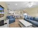 Living room with blue sofas and view of kitchen at 912-B S Ocean Blvd., Surfside Beach, SC 29575