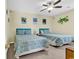 Guest bedroom with two twin beds and ceiling fan at 912-B S Ocean Blvd., Surfside Beach, SC 29575