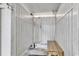 Convenient outdoor shower with wooden bench for rinsing off after swimming at 912-B S Ocean Blvd., Surfside Beach, SC 29575