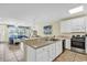 Open kitchen with stainless steel appliances and light-colored cabinetry at 912-B S Ocean Blvd., Surfside Beach, SC 29575
