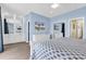 Primary bedroom with king-size bed, dresser, and mirrored closet at 912-B S Ocean Blvd., Surfside Beach, SC 29575