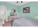 Bedroom with a full-size bed, wicker dresser, TV, and ocean-themed art at 912-B S Ocean Blvd., Surfside Beach, SC 29575