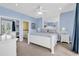 Spacious Primary bedroom with king-size bed, TV and private balcony access at 912-B S Ocean Blvd., Surfside Beach, SC 29575