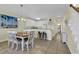 Dining area with kitchen and hallway views, and adjacent to the kitchen at 912-B S Ocean Blvd., Surfside Beach, SC 29575