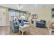 Living room with blue sofas and access to patio at 912-B S Ocean Blvd., Surfside Beach, SC 29575