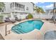 Refreshing blue swimming pool with surrounding lounge chairs at 912-B S Ocean Blvd., Surfside Beach, SC 29575