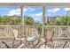 Spacious deck with chairs and a small table, offering street views at 912-B S Ocean Blvd., Surfside Beach, SC 29575