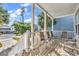 Relaxing front porch with seating area and street views at 912-B S Ocean Blvd., Surfside Beach, SC 29575