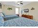 Two twin beds with patterned bedding, dresser, TV and ocean-themed decor at 912-B S Ocean Blvd., Surfside Beach, SC 29575