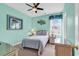 Bedroom with a full-size bed, wicker furniture, and ocean-themed artwork at 912-B S Ocean Blvd., Surfside Beach, SC 29575