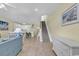 Open living room with kitchen and stairs at 912-B S Ocean Blvd., Surfside Beach, SC 29575