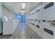Clean and well-lit laundry room with multiple washers and dryers at 1501 S Ocean Blvd. # 1038, Myrtle Beach, SC 29577