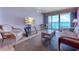 Living room with ocean view and wicker furniture at 1501 S Ocean Blvd. # 1038, Myrtle Beach, SC 29577
