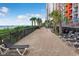 Beachfront pool deck with lounge chairs and palm trees at 1501 S Ocean Blvd. # 1038, Myrtle Beach, SC 29577