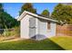 White shed with gray door in backyard at 432 N Smith Rd., Mullins, SC 29574