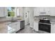 Modern kitchen with white cabinets, stainless steel appliances, and granite countertops at 432 N Smith Rd., Mullins, SC 29574