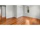 Well-lit bedroom with hardwood floors and a double-door closet at 432 N Smith Rd., Mullins, SC 29574