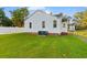 White house back with green lawn and white fence at 432 N Smith Rd., Mullins, SC 29574
