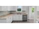 Modern kitchen with white cabinets, stainless steel appliances, and granite countertops at 432 N Smith Rd., Mullins, SC 29574