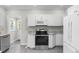 Modern kitchen with white cabinets, stainless steel appliances, and granite countertops at 432 N Smith Rd., Mullins, SC 29574