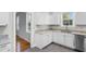 Modern kitchen with white cabinets, stainless steel appliances, and granite countertops at 432 N Smith Rd., Mullins, SC 29574