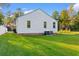 View of the back of house, showcasing the yard and AC unit at 432 N Smith Rd., Mullins, SC 29574