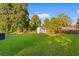 Green grassy backyard with shed and fence at 432 N Smith Rd., Mullins, SC 29574