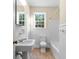 Clean bathroom, featuring a bathtub, toilet and pedestal sink at 432 N Smith Rd., Mullins, SC 29574