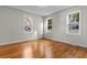 Bright bedroom with hardwood floors and three large windows at 432 N Smith Rd., Mullins, SC 29574