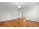 Bright dining room featuring hardwood floors and an open doorway to the hallway at 432 N Smith Rd., Mullins, SC 29574