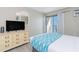 Bedroom with a view and a dresser with a TV at 1207 S Ocean Blvd. # 20703, Myrtle Beach, SC 29577