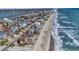 Aerial view of beach neighborhood and ocean at 551 S Waccamaw Dr., Garden City Beach, SC 29576
