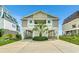 Two story beach home with parking underneath at 551 S Waccamaw Dr., Garden City Beach, SC 29576