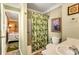 Bathroom with tub shower, sink and toilet at 551 S Waccamaw Dr., Garden City Beach, SC 29576