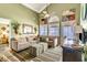 Bright living room with ocean views and ceiling fan at 551 S Waccamaw Dr., Garden City Beach, SC 29576