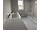 Bathroom with vanity, shower, and white tile floors at 3854 Red Bluff Rd., Loris, SC 29569