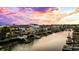 Aerial view of waterfront home with private dock and sunset views at 324 54Th Ave. N, North Myrtle Beach, SC 29582